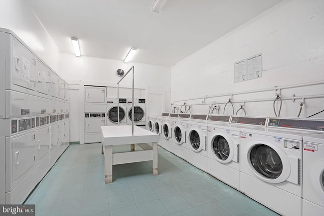 common laundry area featuring stacked washer and dryer and washing machine and dryer