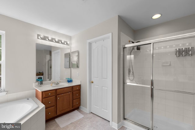 6028 Toomey Ln, Elkridge, MD 21075 - bathroom with vanity, tile patterned flooring, a shower stall, and a bath