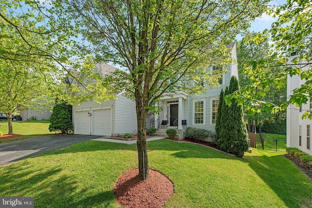 6028 Toomey Ln, Elkridge, MD 21075 - view of front of house with fence, driveway, and a front yard