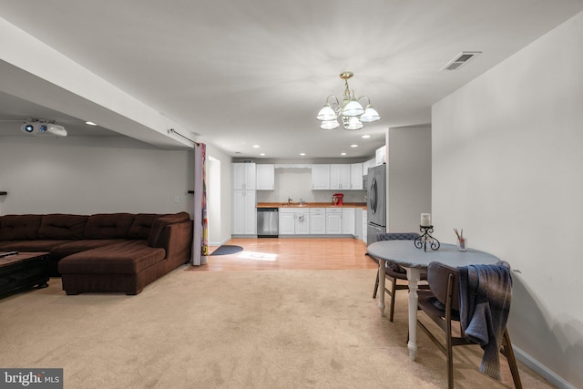 6028 Toomey Ln, Elkridge, MD 21075 - interior space featuring visible vents, baseboards, a notable chandelier, light carpet, and recessed lighting