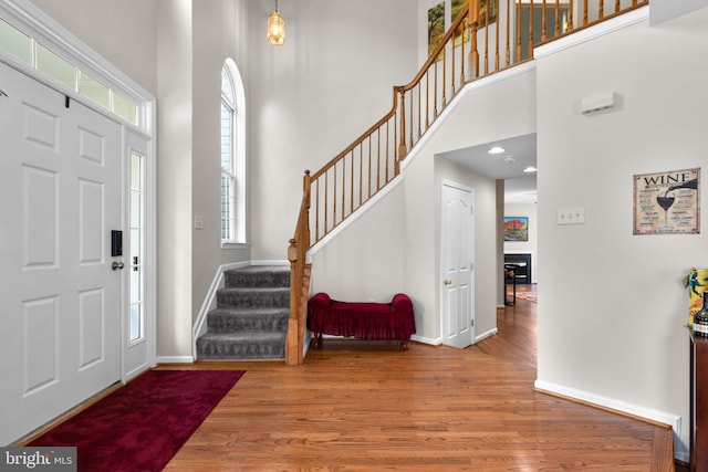 6028 Toomey Ln, Elkridge, MD 21075 - foyer entrance featuring stairway, a healthy amount of sunlight, and a towering ceiling