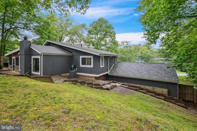 15109 Watergate Rd, Silver Spring, MD 20905 - back of house featuring a chimney and roof with shingles