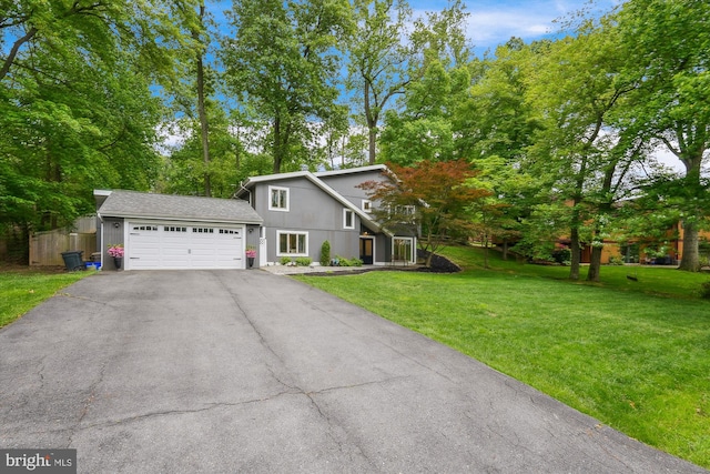 15109 Watergate Rd, Silver Spring, MD 20905 - view of front of home featuring driveway, a garage, and view of scattered trees