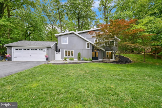 15109 Watergate Rd, Silver Spring, MD 20905 - view of front of home featuring driveway, a front yard, and an attached garage