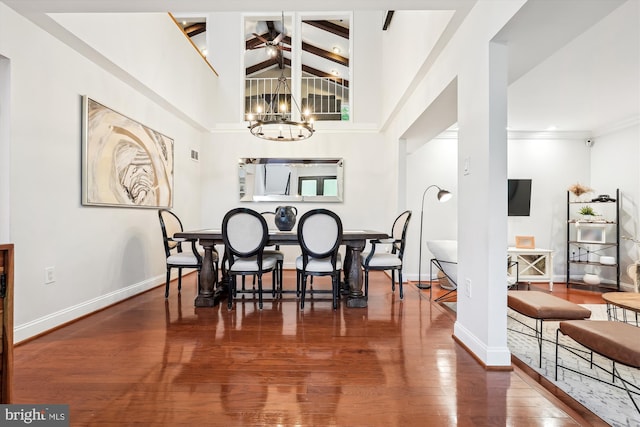 15109 Watergate Rd, Silver Spring, MD 20905 - dining area featuring a chandelier, baseboards, beamed ceiling, wood finished floors, and high vaulted ceiling