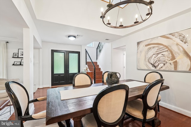 15109 Watergate Rd, Silver Spring, MD 20905 - dining room featuring stairs, wood finished floors, baseboards, and a chandelier