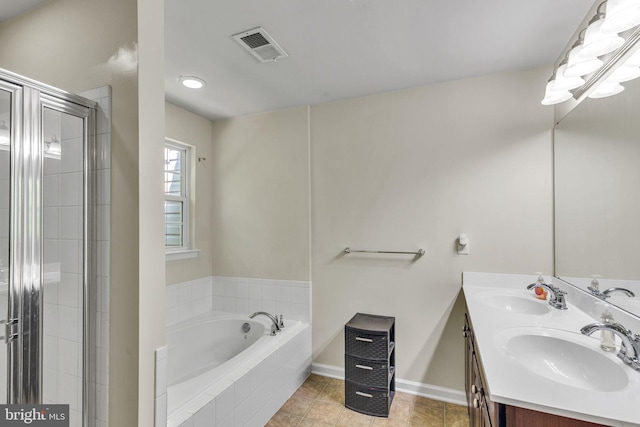 full bath featuring a sink, a garden tub, a stall shower, and visible vents
