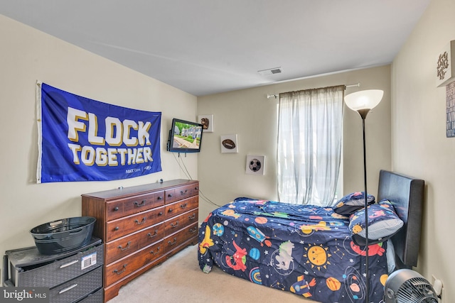 bedroom featuring carpet floors and visible vents