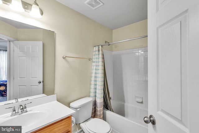 bathroom featuring vanity, shower / tub combo with curtain, toilet, and visible vents