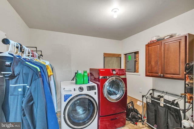 laundry room with separate washer and dryer, cabinet space, and electric panel