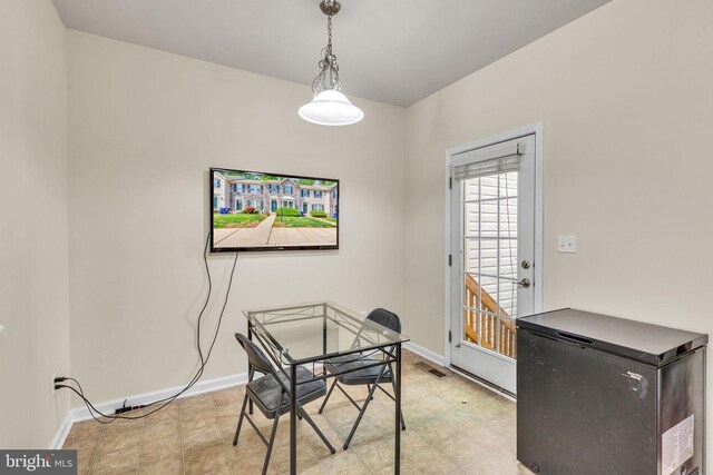 dining space featuring baseboards