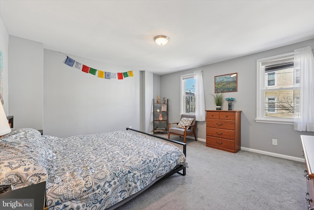 bedroom with carpet and baseboards