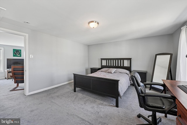 carpeted bedroom with baseboards