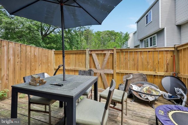 1660 Thenia Pl, Woodbridge, VA 22192 - exterior space with a deck, outdoor dining area, and a fenced backyard