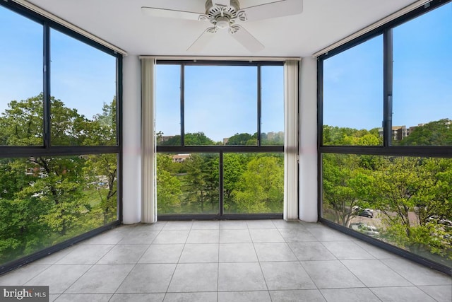 unfurnished sunroom with tile patterned floors and expansive windows