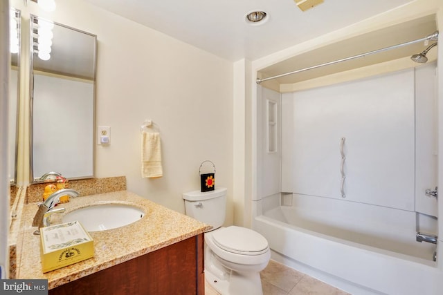 bathroom with vanity, tile patterned flooring, toilet, and  shower combination