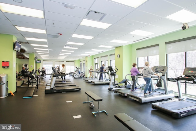 workout area featuring visible vents and a paneled ceiling
