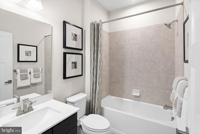 full bath featuring shower / tub combo, toilet, and vanity