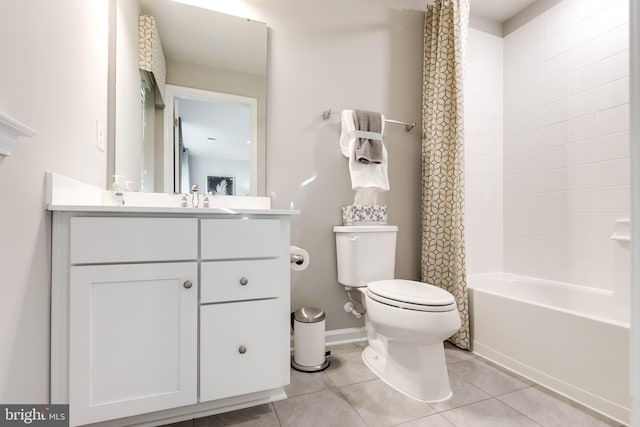 full bathroom with toilet, tile patterned floors, shower / bath combination with curtain, and vanity