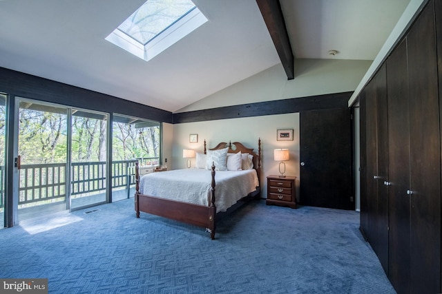 carpeted bedroom featuring access to outside and lofted ceiling with skylight