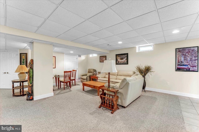carpeted living room with a paneled ceiling, recessed lighting, and baseboards