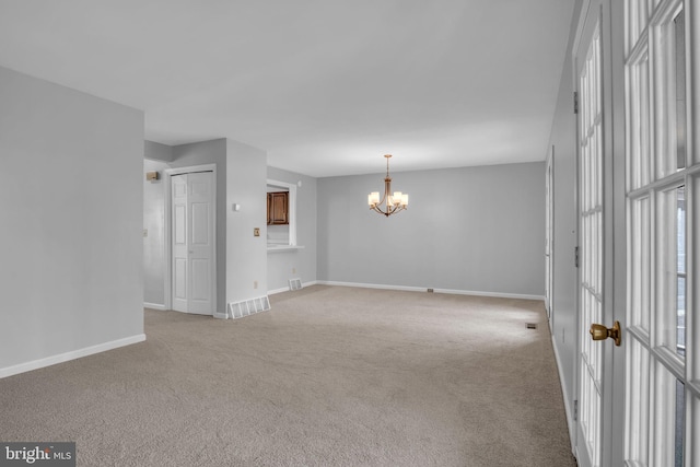 451 Lovell Ct, Hummelstown, PA 17036 - carpeted empty room featuring an inviting chandelier, visible vents, and baseboards