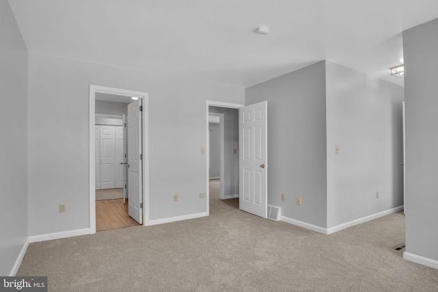 451 Lovell Ct, Hummelstown, PA 17036 - unfurnished bedroom featuring visible vents, connected bathroom, carpet flooring, and baseboards