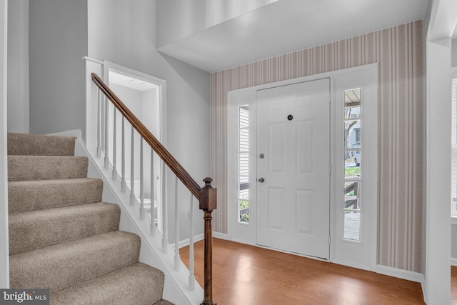 451 Lovell Ct, Hummelstown, PA 17036 - foyer with baseboards, wallpapered walls, wood finished floors, and stairs