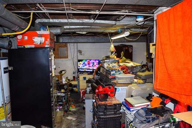 unfinished below grade area with gas water heater and heating unit
