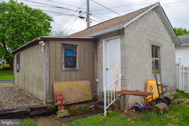 view of outdoor structure featuring fence and entry steps