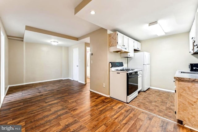 4600 Duke St Unit 1118, Alexandria, VA 22304 - kitchen featuring white appliances, wood finished floors, baseboards, light countertops, and under cabinet range hood