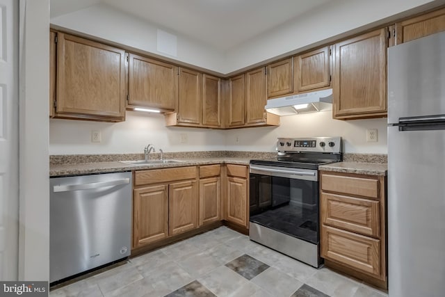 11409 Fruitwood Way Unit 163, Germantown, MD 20876 - kitchen with stainless steel appliances, under cabinet range hood, a sink, and light countertops