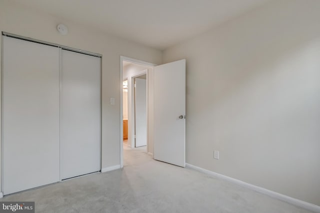 11409 Fruitwood Way Unit 163, Germantown, MD 20876 - unfurnished bedroom with light colored carpet, baseboards, and a closet