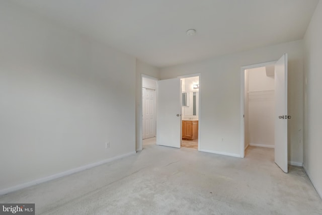 11409 Fruitwood Way Unit 163, Germantown, MD 20876 - unfurnished bedroom with a spacious closet, light carpet, baseboards, and a closet