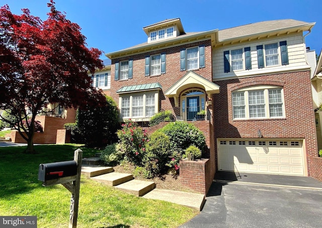 807 Woodside Pkwy, Silver Spring, MD 20910 - view of front of home featuring an attached garage, brick siding, driveway, and a front lawn
