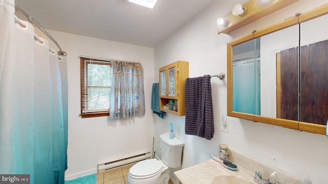 521 E Rdg Loop Rd, Romney, WV 26757 - full bathroom with toilet, vanity, tile patterned floors, baseboard heating, and baseboards