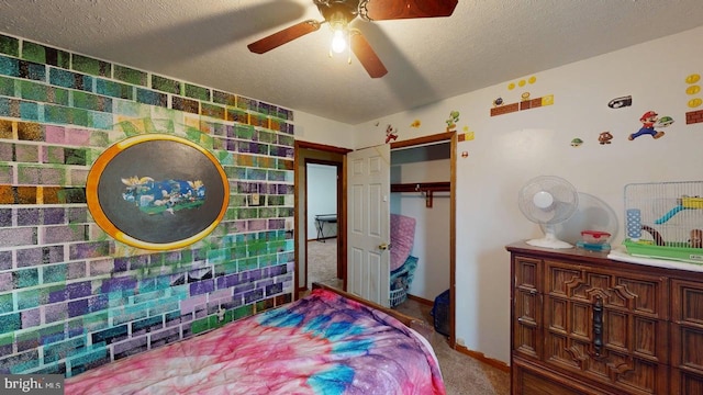 521 E Rdg Loop Rd, Romney, WV 26757 - carpeted bedroom with a closet, a textured ceiling, baseboards, and a ceiling fan