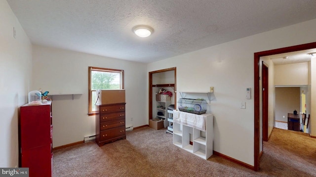 521 E Rdg Loop Rd, Romney, WV 26757 - interior space with a baseboard radiator, a textured ceiling, and baseboards