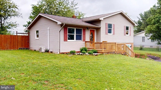 521 E Rdg Loop Rd, Romney, WV 26757 - split level home featuring central air condition unit, fence, a deck, crawl space, and a front lawn