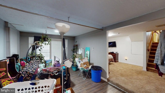 521 E Rdg Loop Rd, Romney, WV 26757 - dining area with stairway, a textured ceiling, baseboards, and wood finished floors