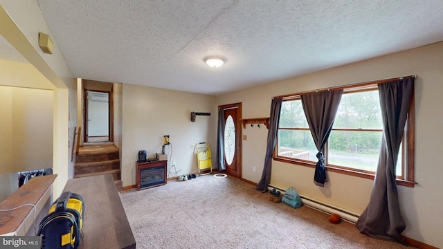 521 E Rdg Loop Rd, Romney, WV 26757 - interior space with carpet flooring, a textured ceiling, baseboards, a baseboard radiator, and stairs
