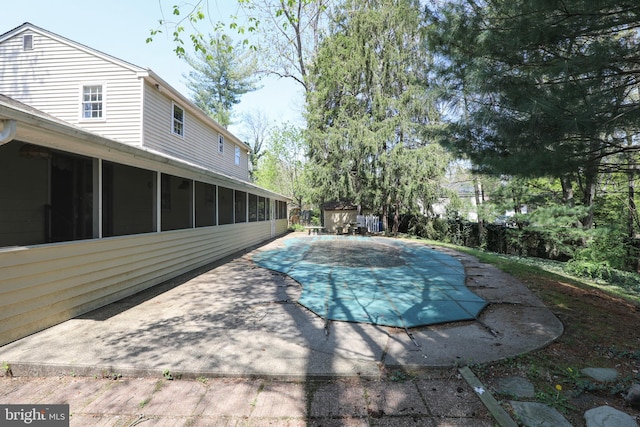 72 Bennett Dr, Doylestown, PA 18901 - view of pool with a sunroom, a patio area, an outbuilding, a fenced in pool, and a shed