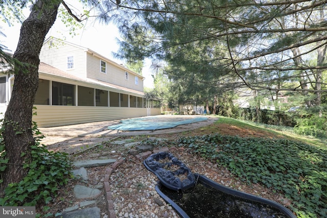72 Bennett Dr, Doylestown, PA 18901 - view of yard featuring a sunroom and a patio area