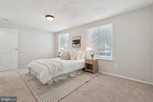 2963 Crystal Palace Ln, Pasadena, MD 21122 - carpeted bedroom with baseboards, a textured ceiling, and visible vents