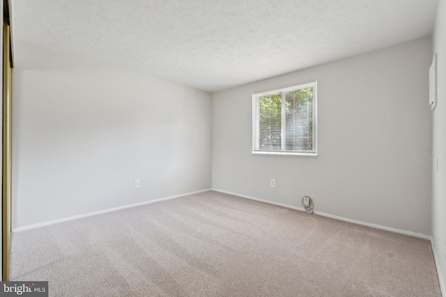2963 Crystal Palace Ln, Pasadena, MD 21122 - carpeted spare room featuring baseboards and a textured ceiling