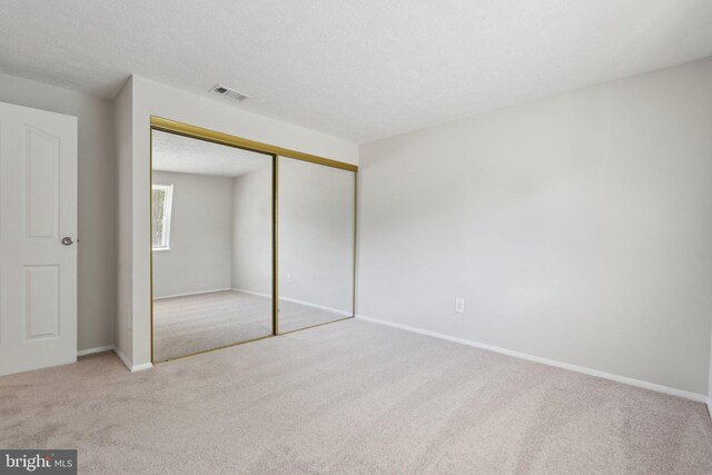 2963 Crystal Palace Ln, Pasadena, MD 21122 - unfurnished bedroom featuring visible vents, carpet flooring, baseboards, and a closet