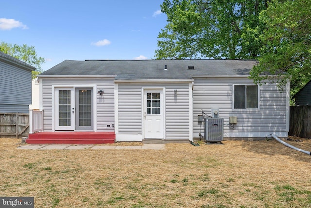 2963 Crystal Palace Ln, Pasadena, MD 21122 - rear view of property featuring fence, central air condition unit, a yard, and french doors