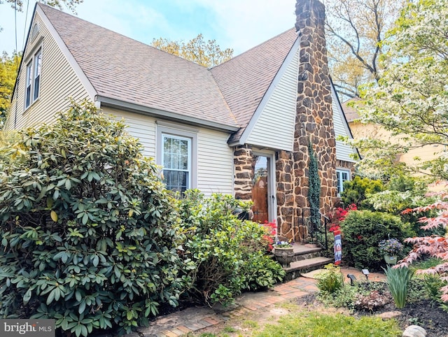 view of front of house featuring roof with shingles