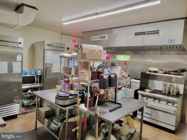 kitchen featuring appliances with stainless steel finishes, visible vents, and tile patterned flooring