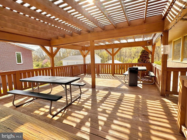 wooden deck with outdoor dining area and a pergola